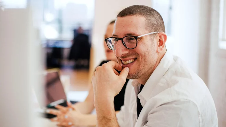 Stock photo - person smiling at office close up banner