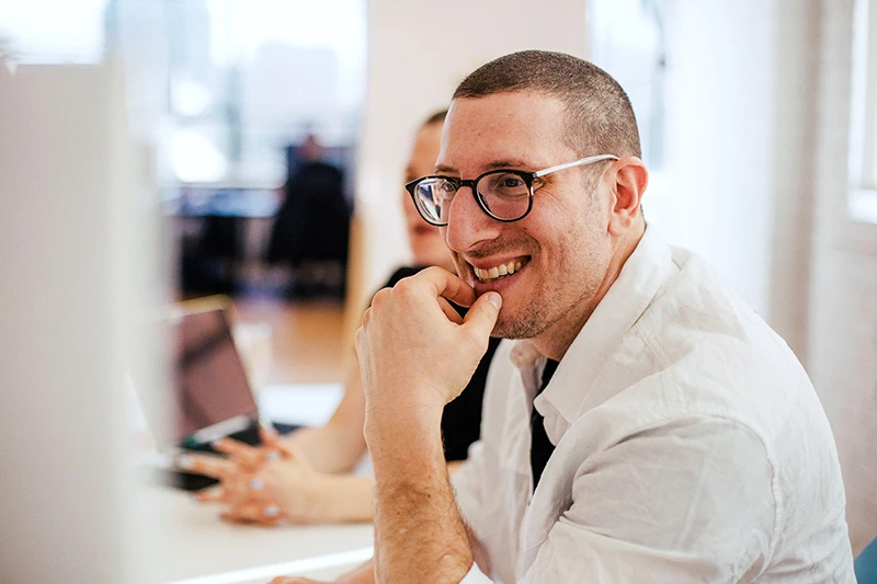 Stock photo - person smiling at office close up