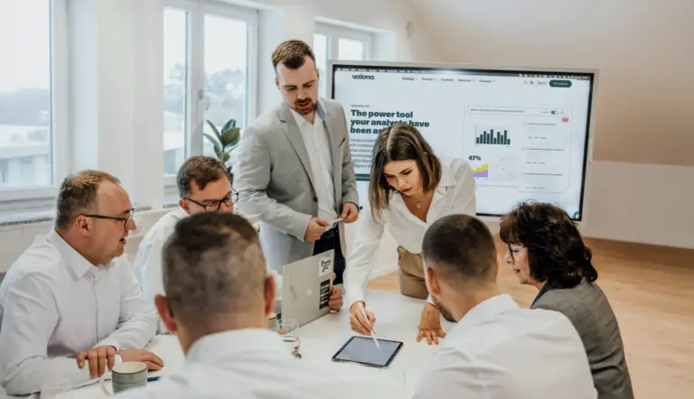 Group of people working around a table