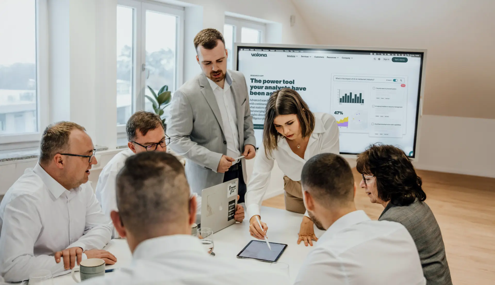 Group of people working around a table