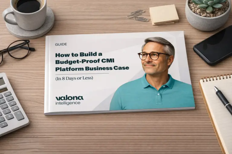 Printed guide on building a budget-proof CMI platform business case, showcasing market intelligence software, placed on a modern office desk with notebook, phone, and coffee.